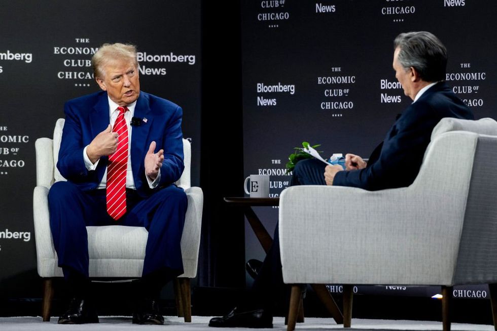 Bloomberg interviewer's attempts to needle Trump backfire — and the crowd loves it