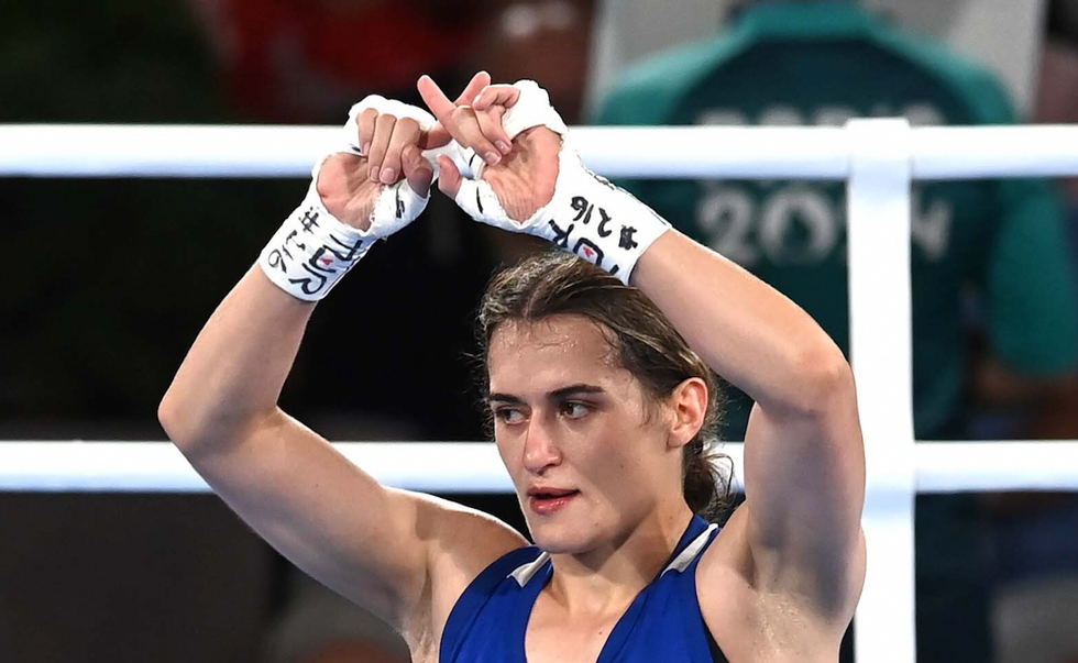 Female Olympic boxer makes 'X' symbol in apparent protest after semifinal loss to opponent embroiled in gender controversy