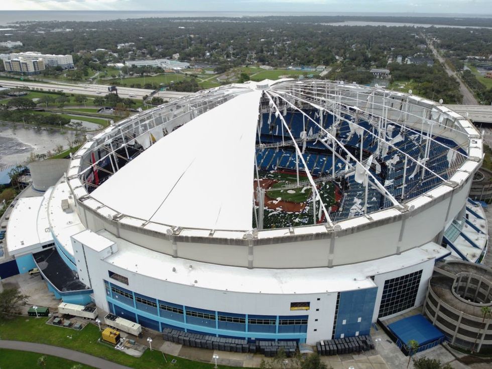 Hurricane Milton tears through Florida, shredding roof off stadium used as shelter for first responders