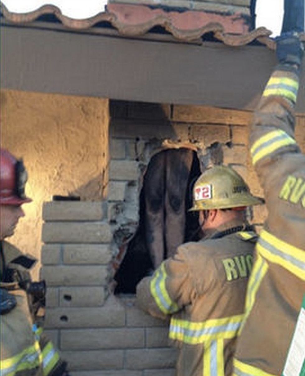 Firefighters Bust Through Chimney Wall and Find These Dangling Inside (UPDATED)