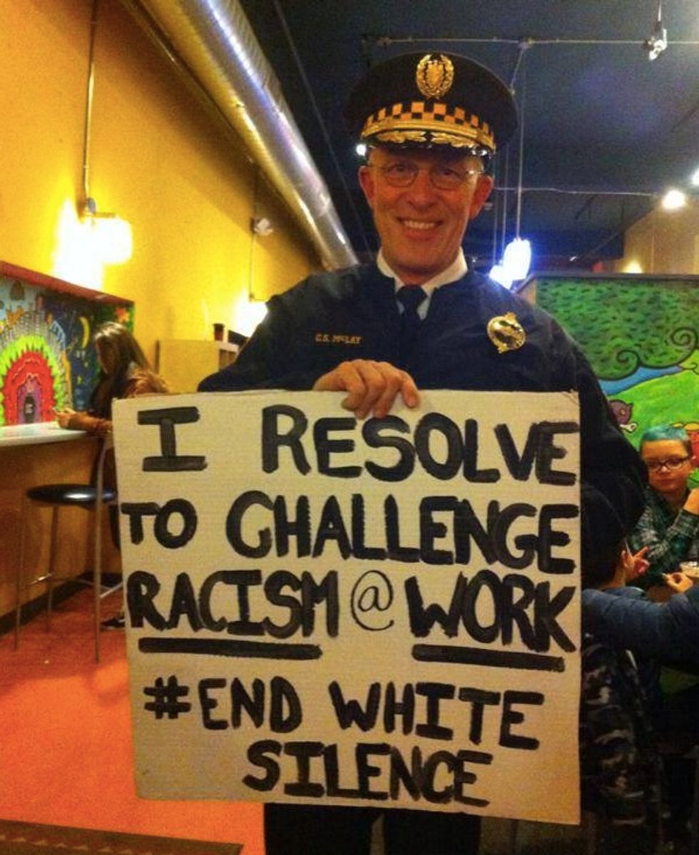 Photo of Smiling Police Chief Holding Activists' Controversial Sign Has 'Angered a Lot of Officers