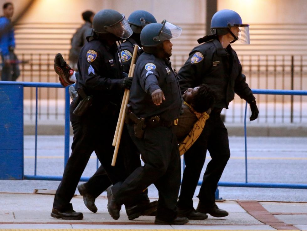 Protesters Smash Out Police Car Windows and Storefronts as Thousands Rally for Freddie Gray (UPDATE: Baseball Fans Asked to Stay Inside Stadium)