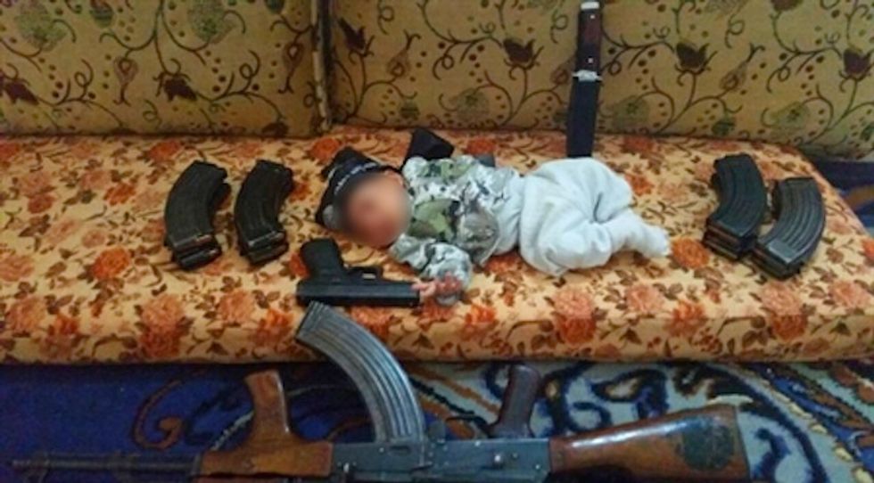 A Newborn Is Once Again Used as Prop for Islamic State Propaganda Pic. Guess What Job the Father Used to Have.