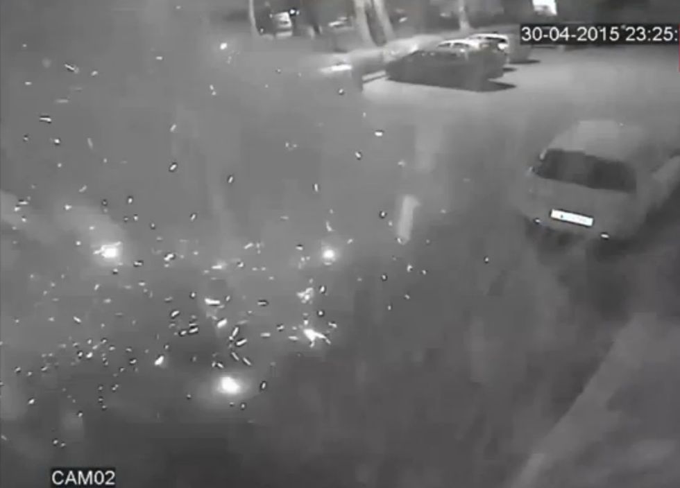 Surveillance Video Shows Violent Blast After a Hooded Figure Places a Bomb Underneath a Car