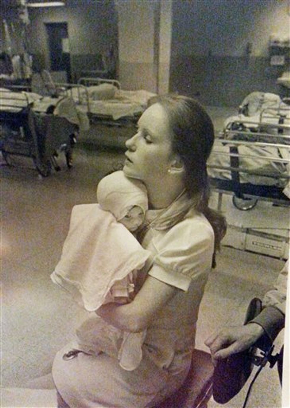 The Nurse Comforting Baby With Burn Wounds in This Touching Photo Is About to Meet the Woman She's Become