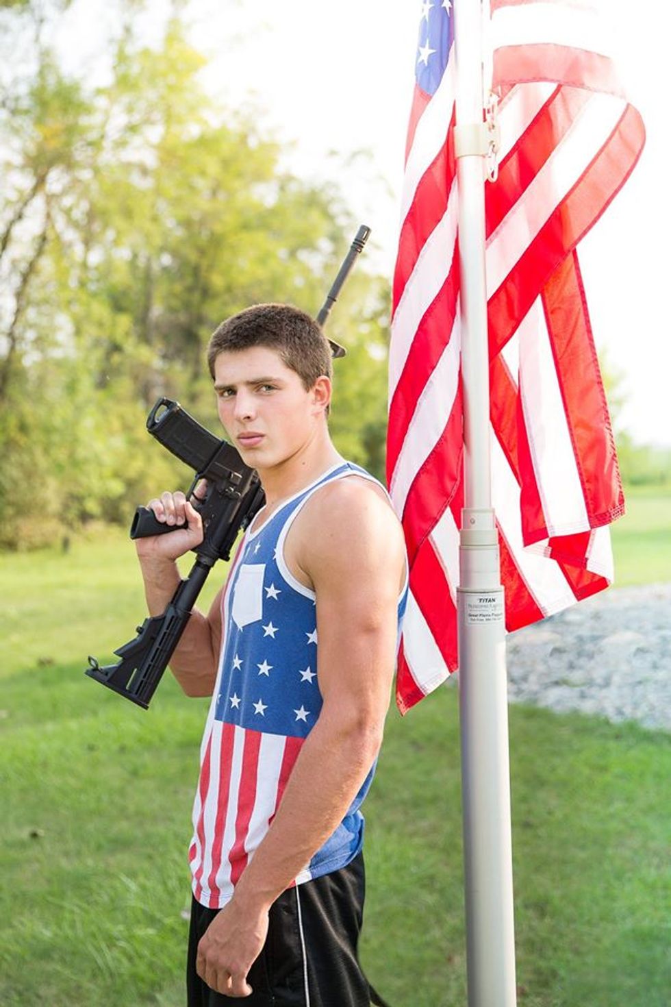 School Smacks Down Student's Yearbook Photo Featuring Rifle, American Flag — See How This No-Nonsense Dad Responds