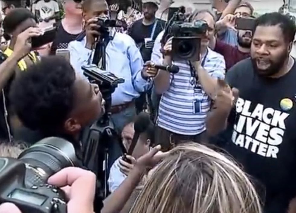 16-Year-Old Black Trump Supporter Battles Older Black Trump Protester in Fiery Sidewalk Debate. Check Out Who Gains the Upper Hand.