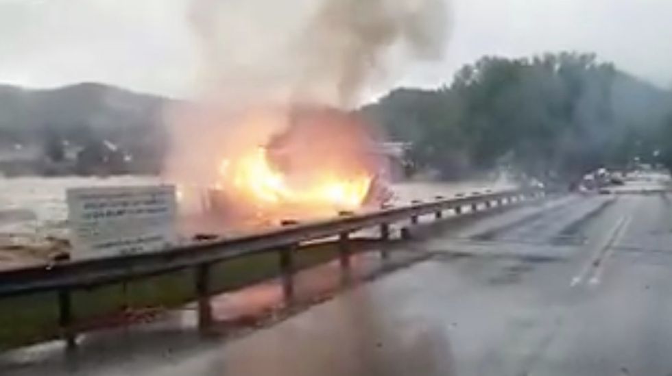 Burning House Swept Away By Horrific Flooding in West Virginia