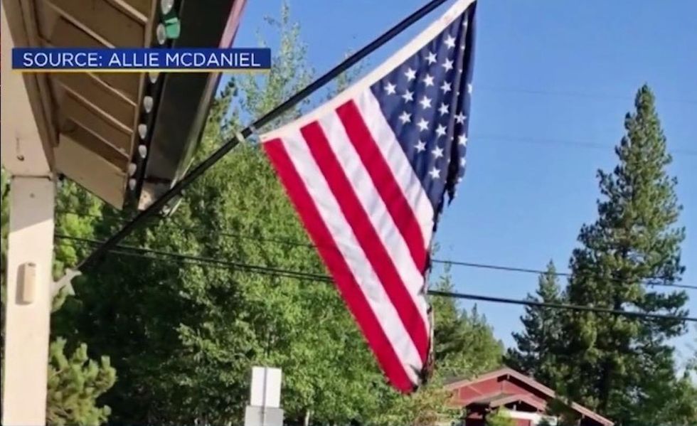 He took offense to US flag displayed at night without light on it — so cops said he fixed it. Badly.