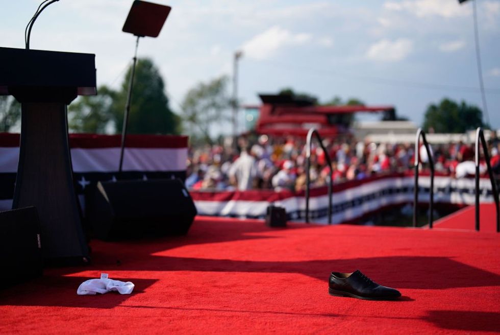 Newly surfaced video shows rallygoers notifying police of would-be assassin right before shots fired at Trump