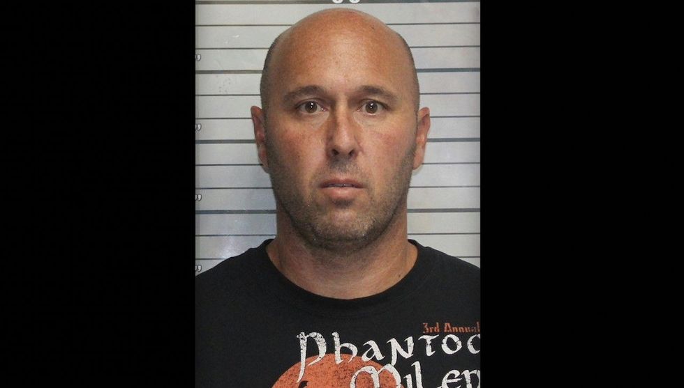 FBI finds elementary school gym teacher in hotel room with naked girl, 5 or 6 years old; he's arrested on child porn charges