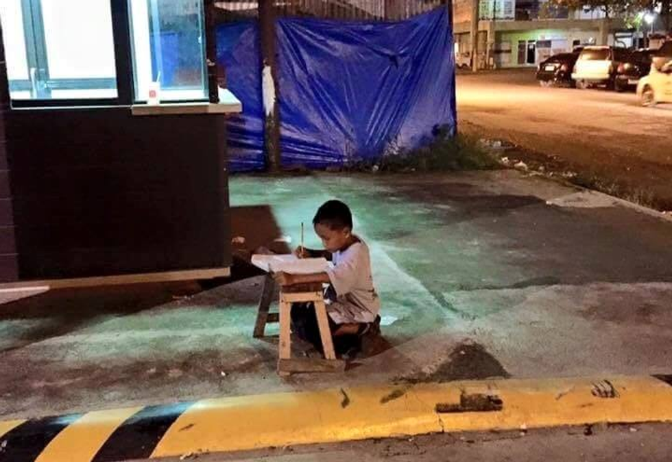 Image of Homeless Boy Using Light of McDonald's Restaurant to Do His Homework Has Been Shared by Millions — This Is His Story