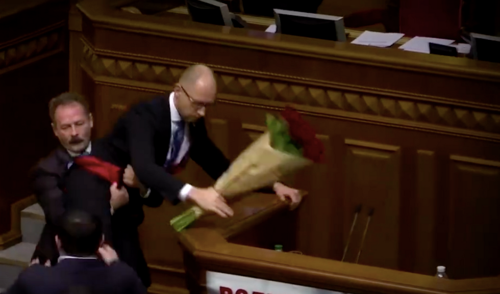 Member of Ukrainian Parliament Walks to PM, Hands Him Bouquet of Roses — Then Things Get Very Crazy