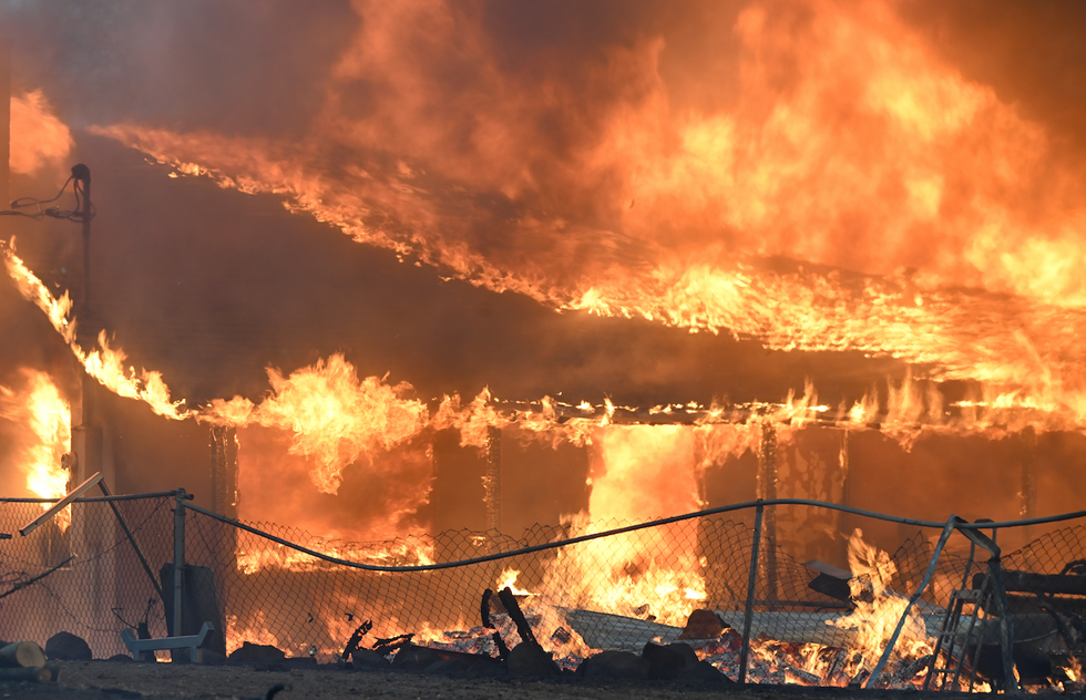 Man accused of sparking massive California wildfire by pushing fiery car into gully; fire already burned 164,000 acres