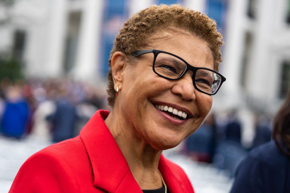 Karen Bass was enjoying a cocktail party, taking photos in a foreign land while her city burned