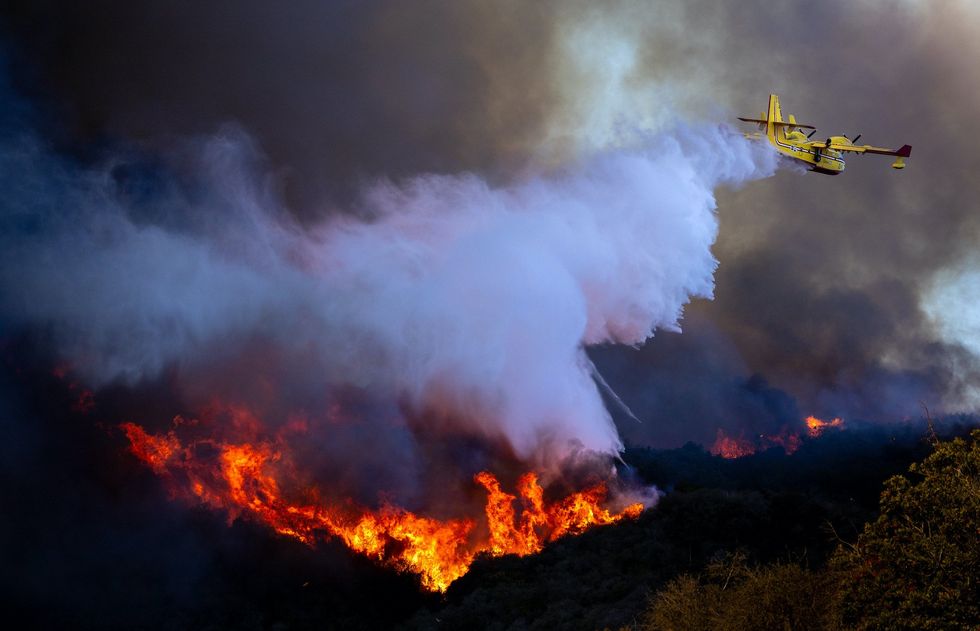 Plane scooping water from ocean to fight wildfires grounded after hitting drone illegally flying over Pacific Palisades