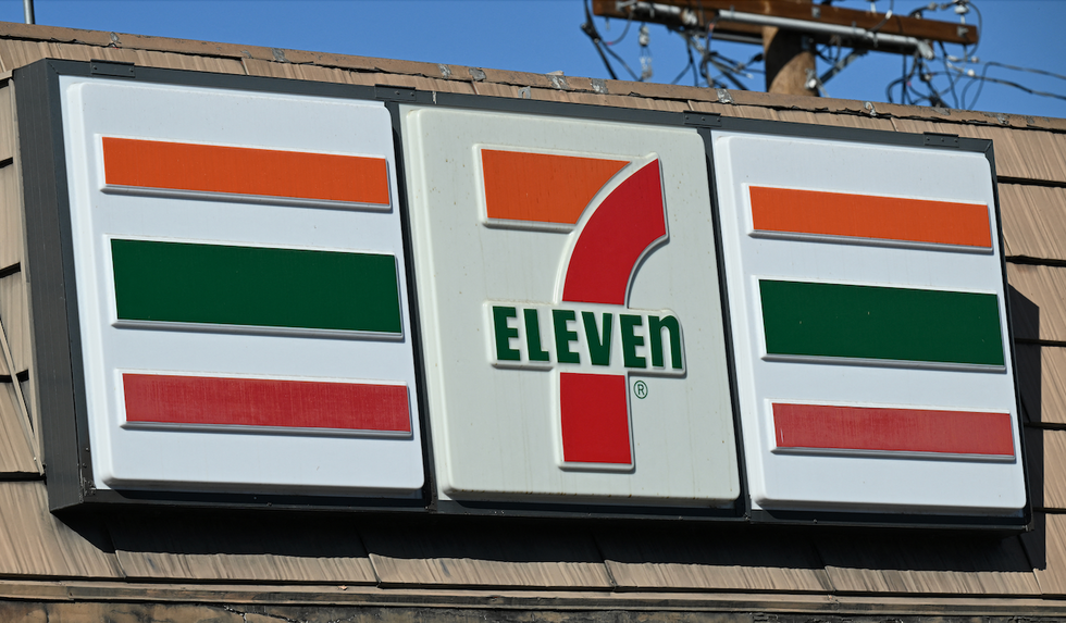 Street takeover thugs beat up 7-Eleven worker who tries to keep them from looting store. But he's no match for mob of 50.