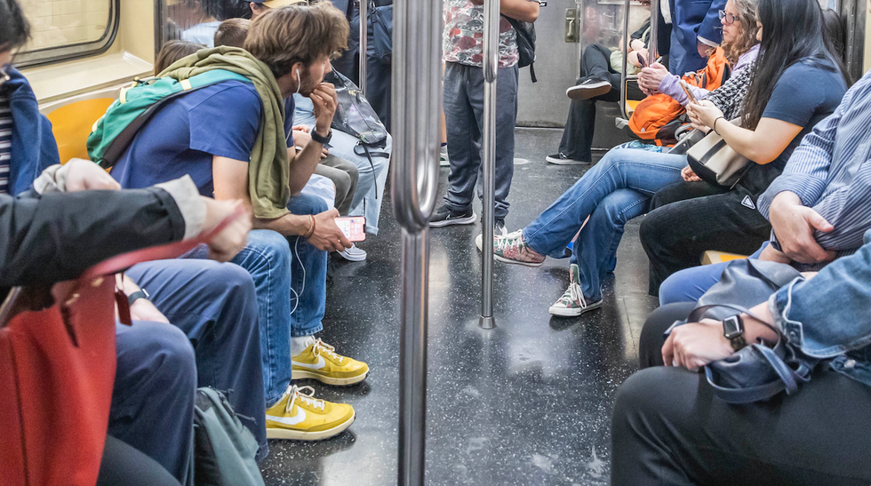 Subway rider fights back after 'much bigger' passenger slaps him in face, sends his glasses flying