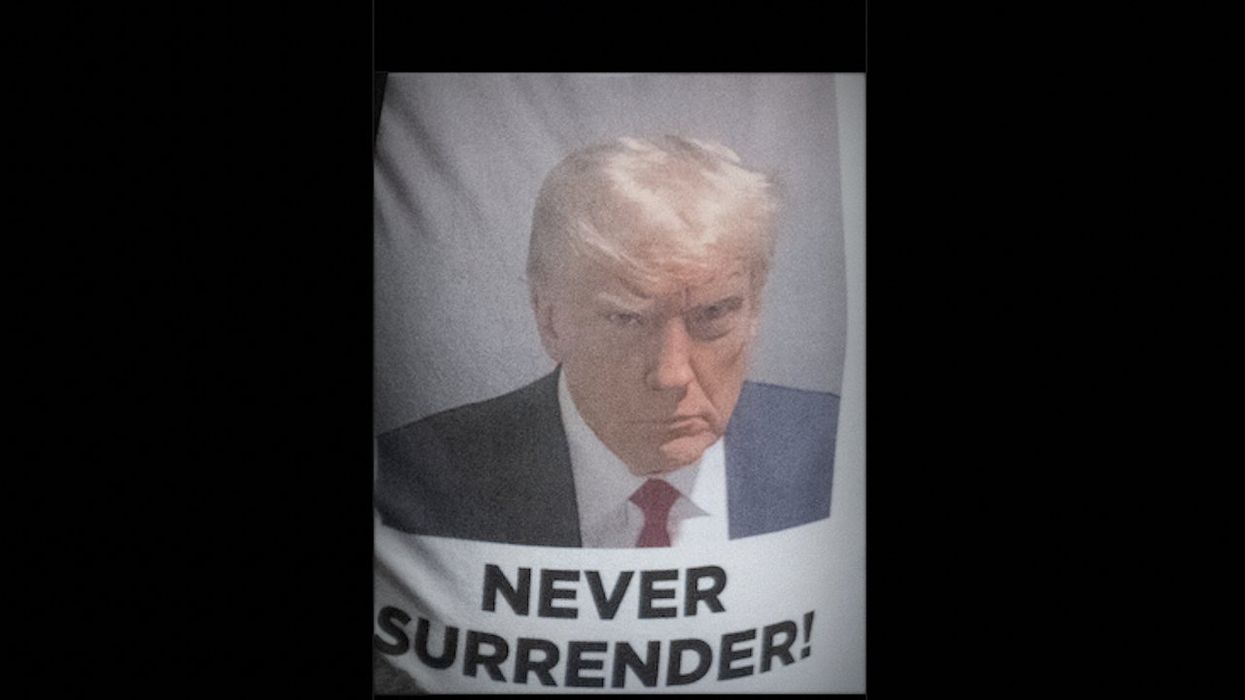 Trump fans unfurl 'Never Surrender' banner with his mug shot during national anthem at Yankee Stadium