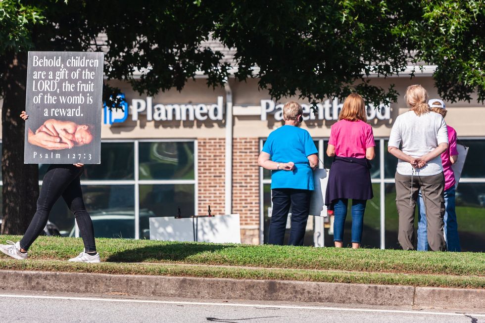 Video: Pro-life Christian detained for preaching the gospel outside abortion clinic, defiantly returns to save unborn lives